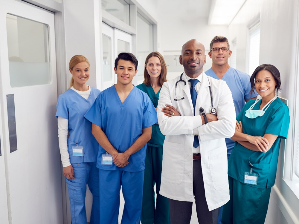 a group of medical professionals standing in a hallway
