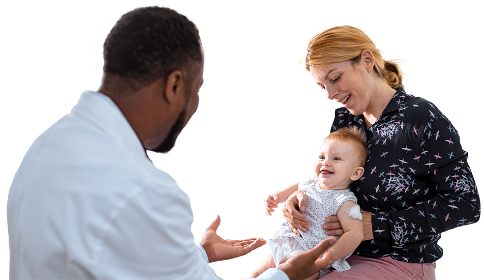 Doctor talking to parent holding child