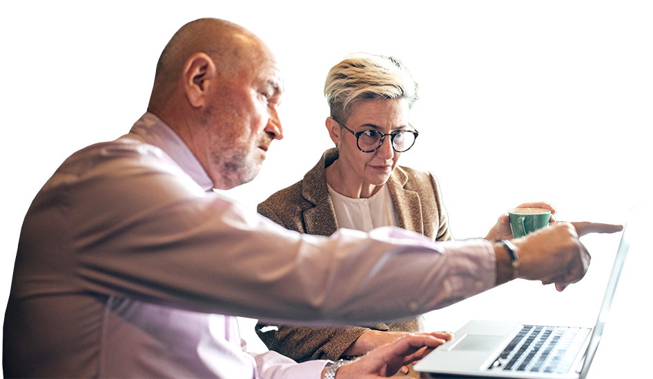 Man and woman in discussion while looking at laptop