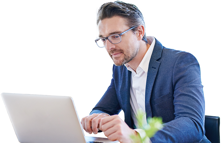 Man in glasses looking at laptop computer