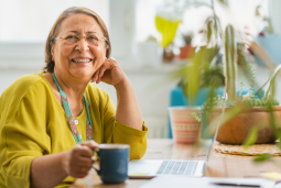 Woman smiling while sitting at desk