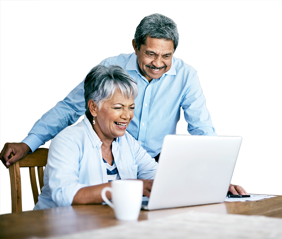 Man and woman smiling looking at laptop computer