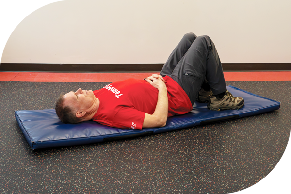 Lie on your back with your knees bent and your feet flat on the floor.