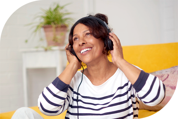 Person listening to music with headphones.