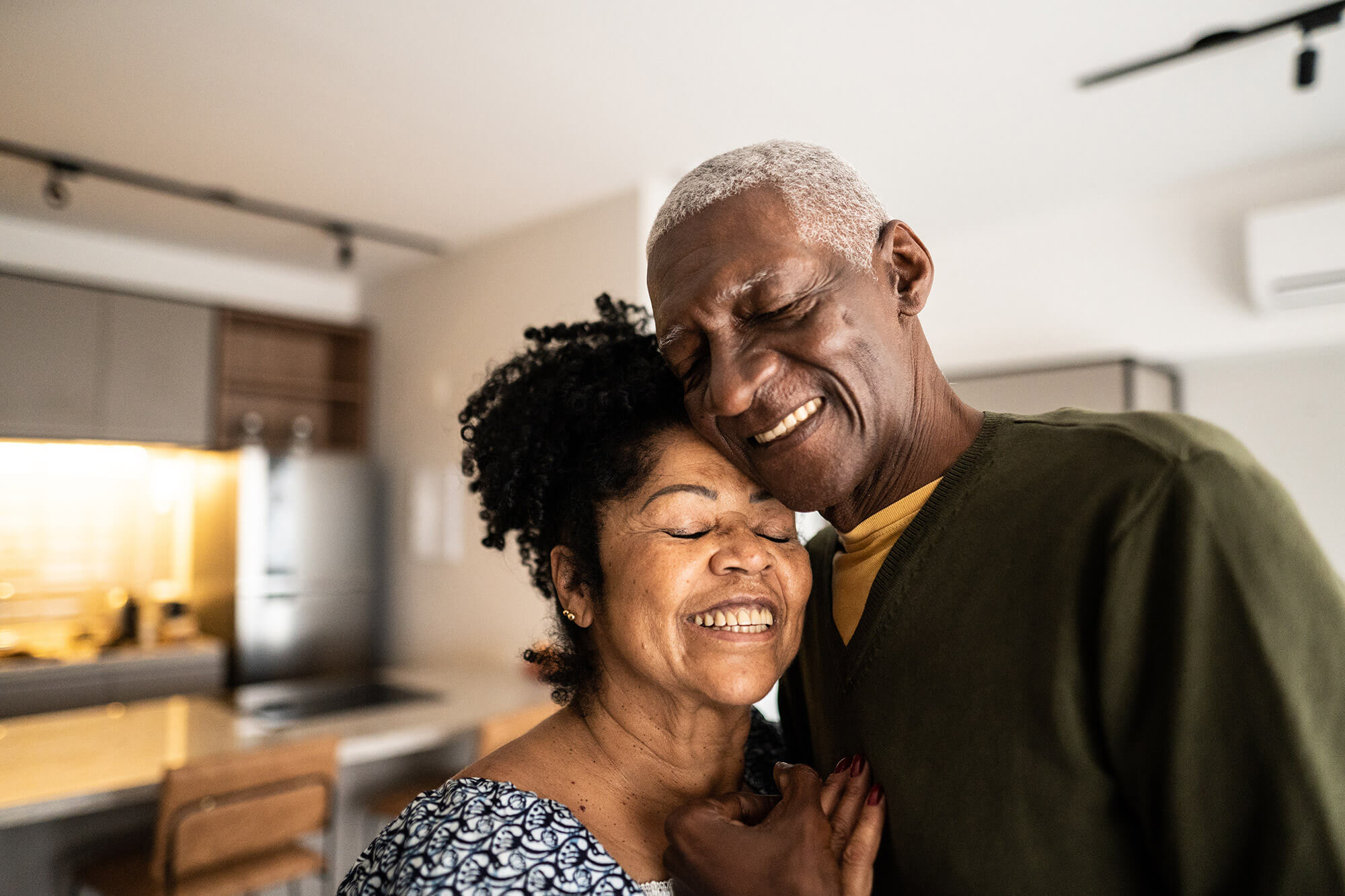 an older couple embracing each other