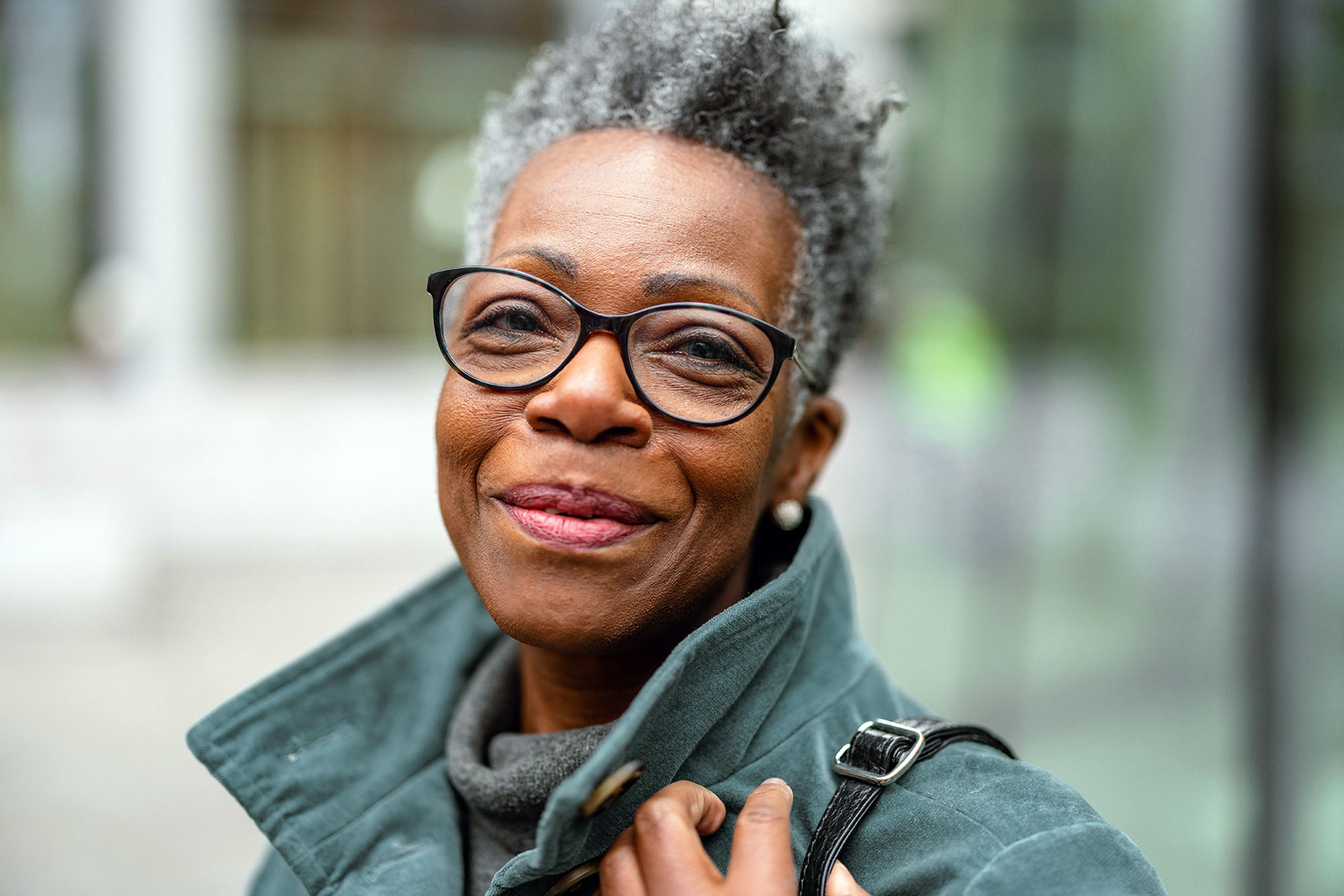 older woman smiling outdoors