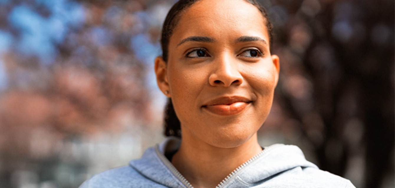 woman smirking and looking away