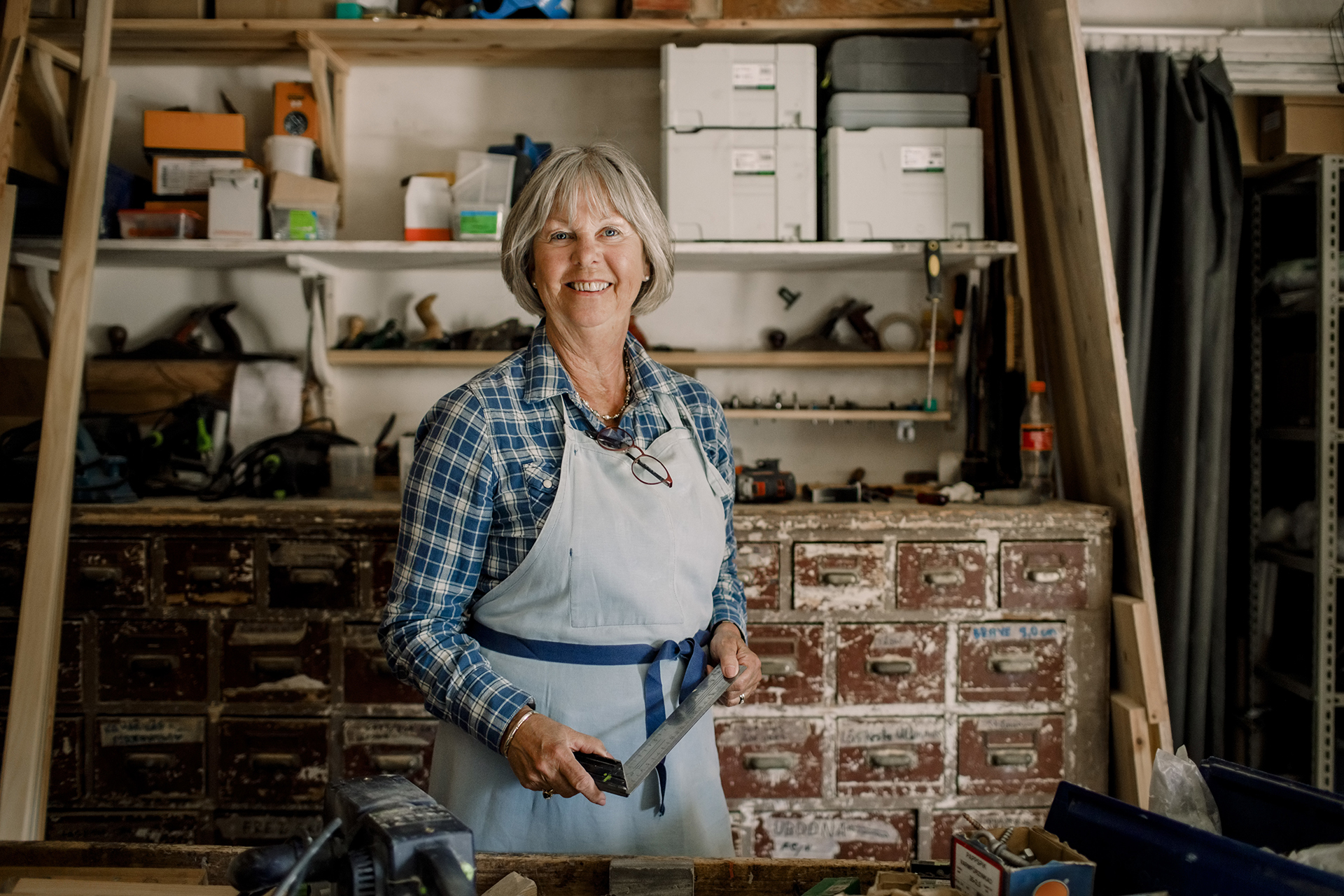 craftswoman smiling in her workshop