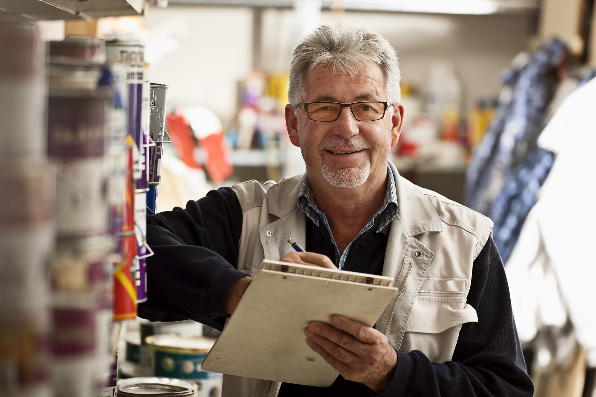 shopkeeper checking inventory before leaving for Medicare seminar