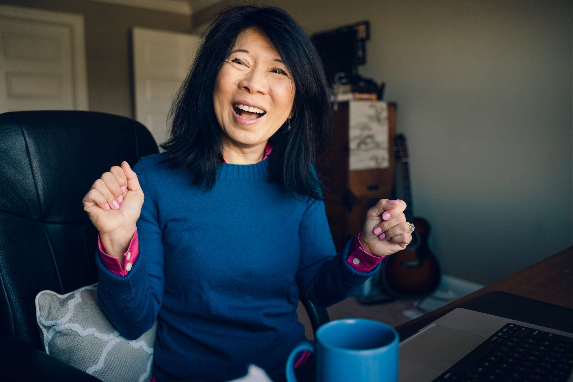 cheery woman with coffee reads mvp quick guide to medicare
