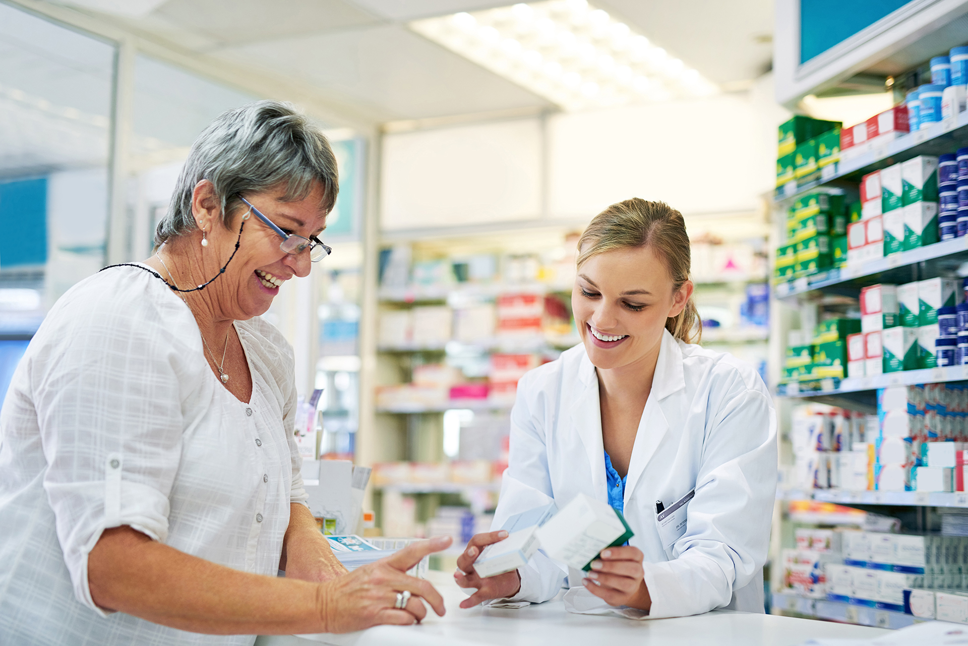 happy pharmacist and customer