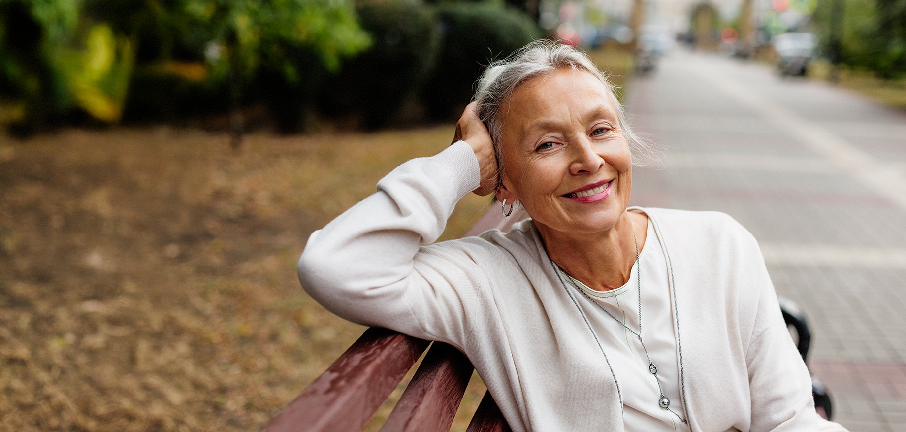 senior woman resting on park bench