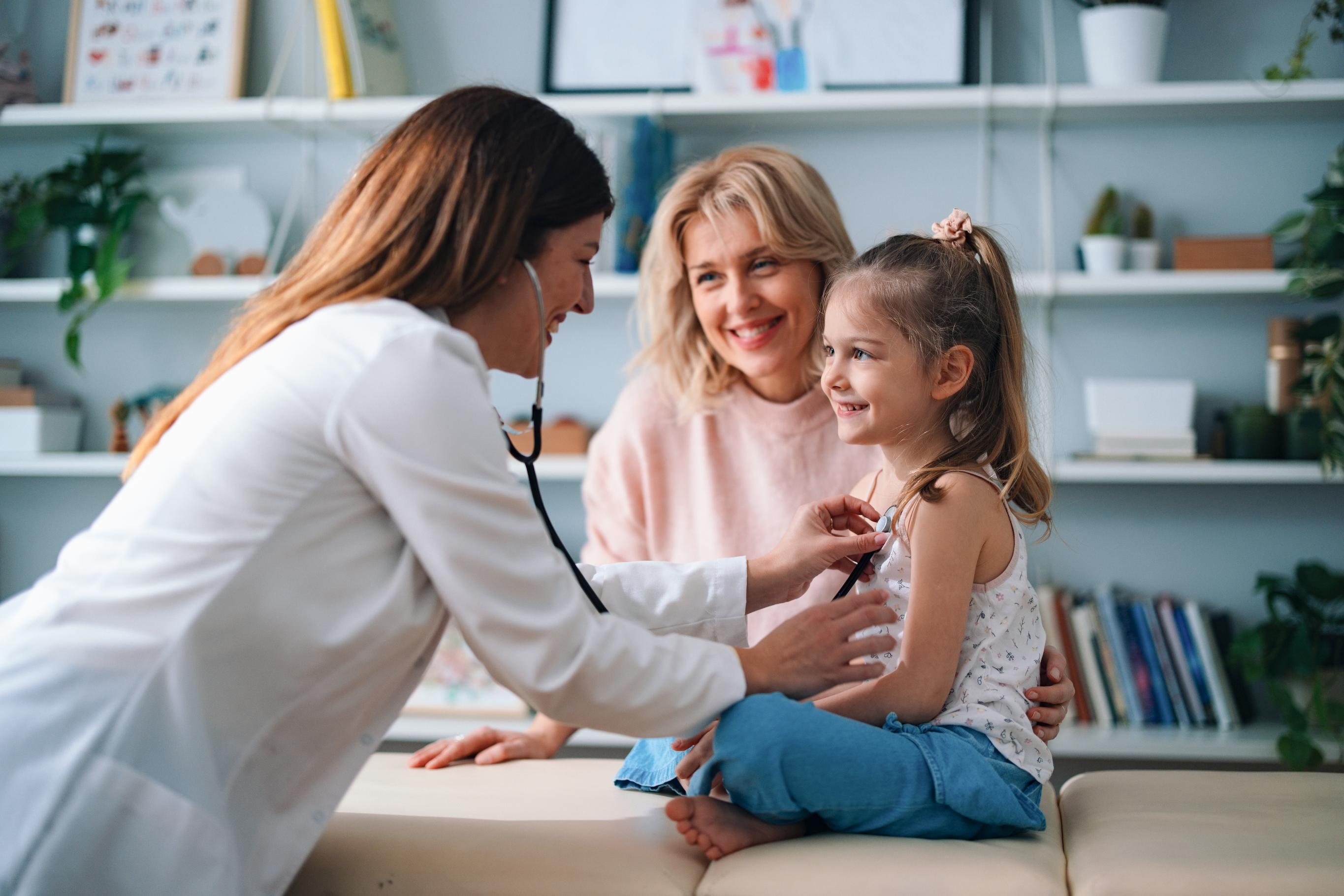 doctor with mother and child