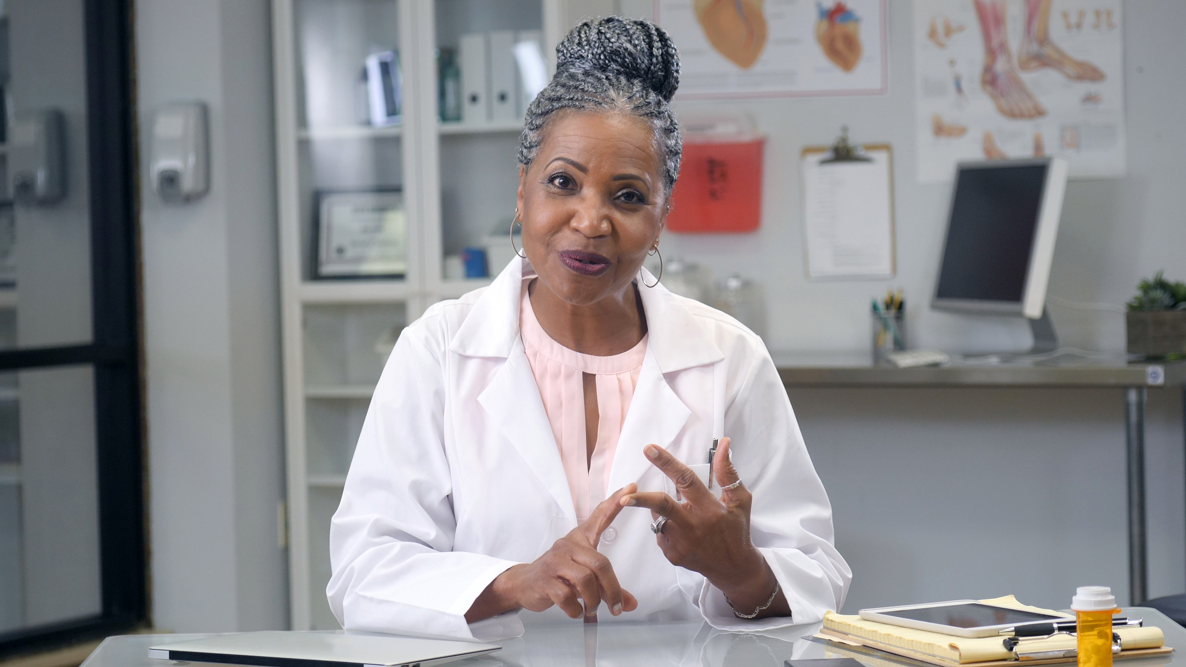 cheerful-doctor-shares-advice-during-web-conference cheerful doctor shares advice during web conference