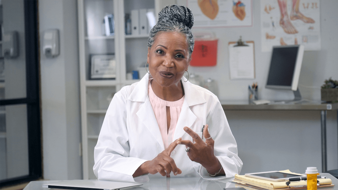 cheerful doctor shares advice during web conference