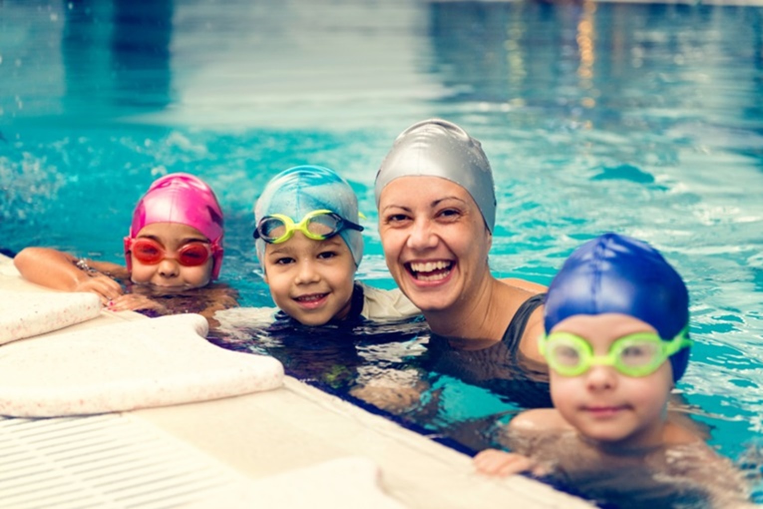 woman and children swimming thumbnail