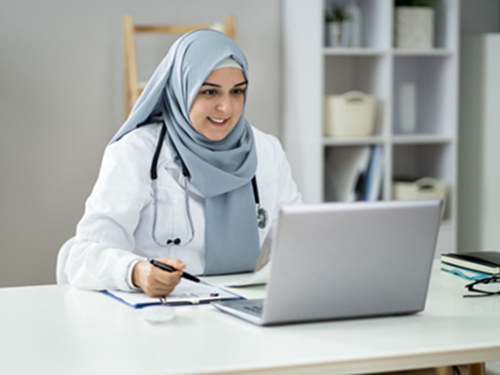 doctor working on laptop