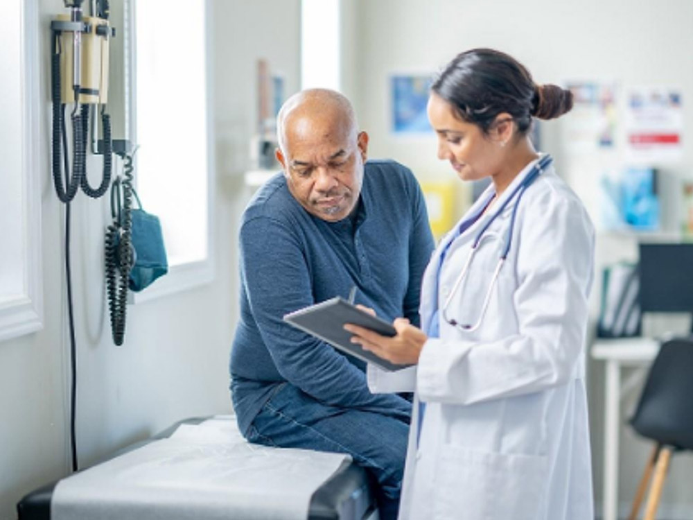 doctor speaking with an elderly patient