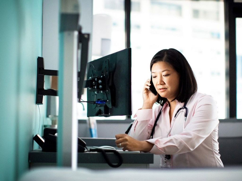 a female doctor talking on the phone