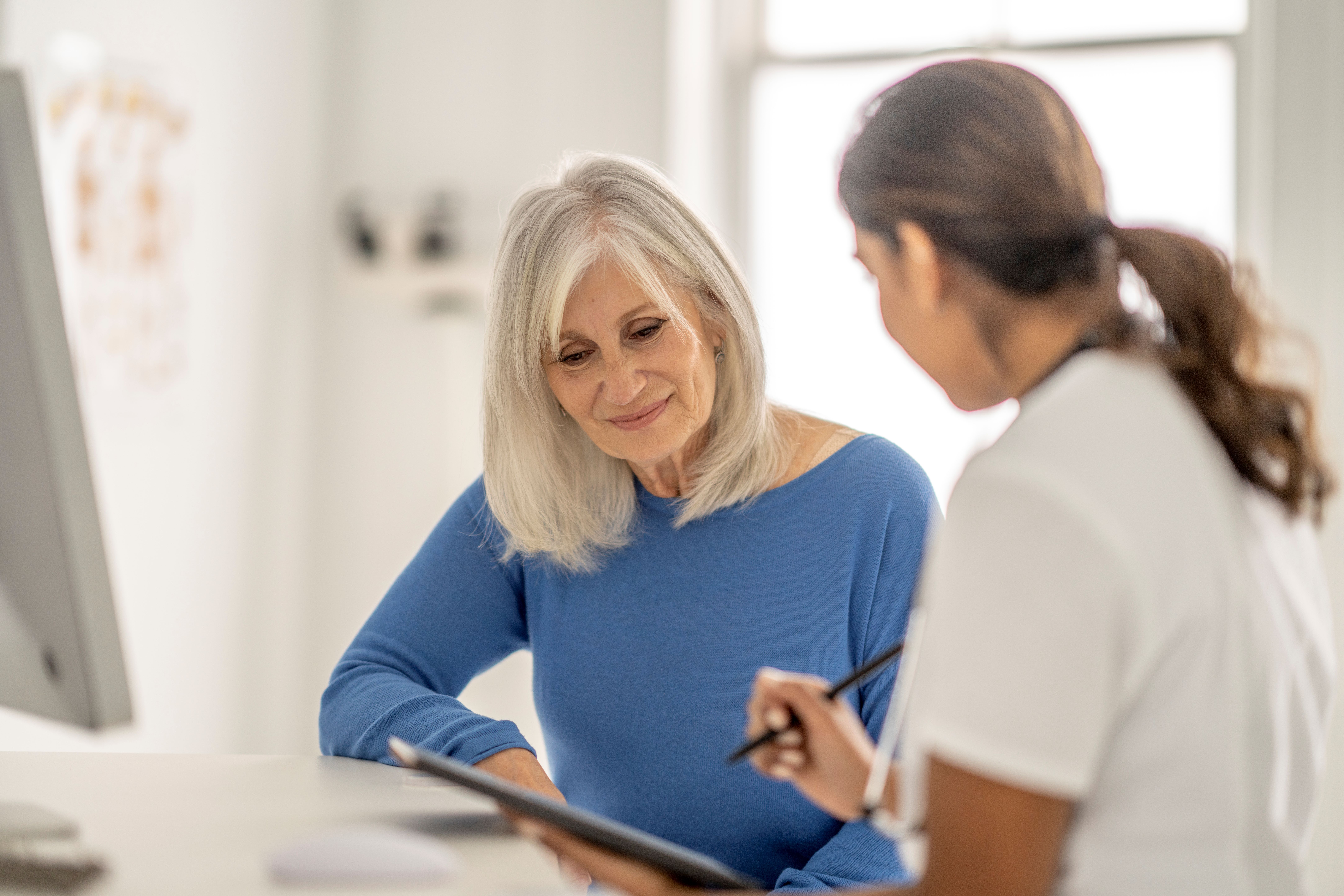 doctor-explaining-to-elderly-patient Doctor explaining to elderly patient