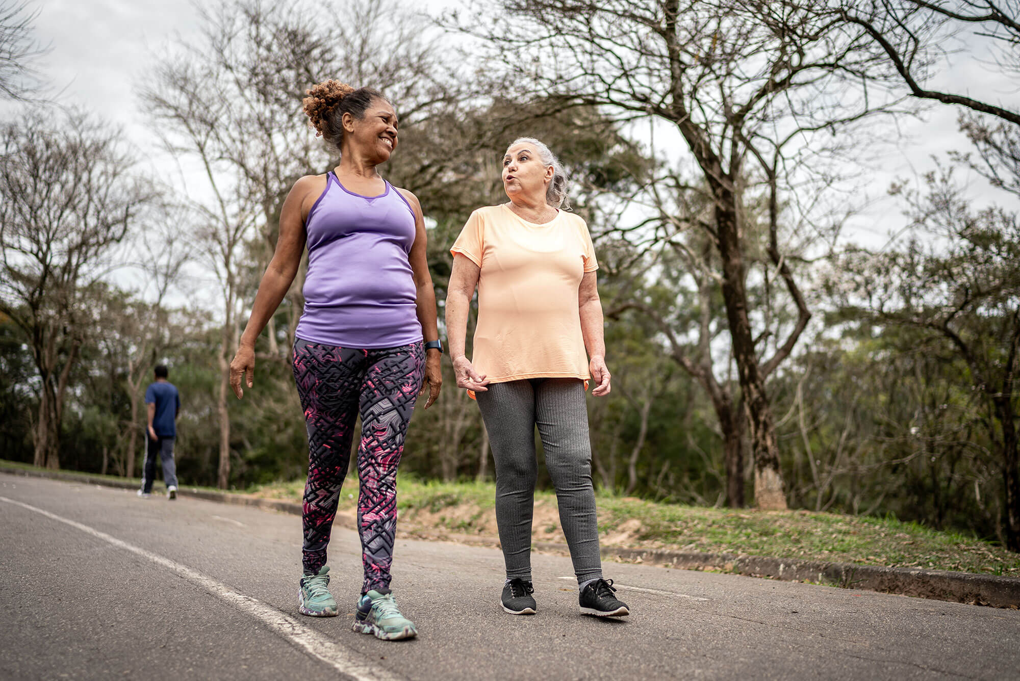 two women walking outdoors