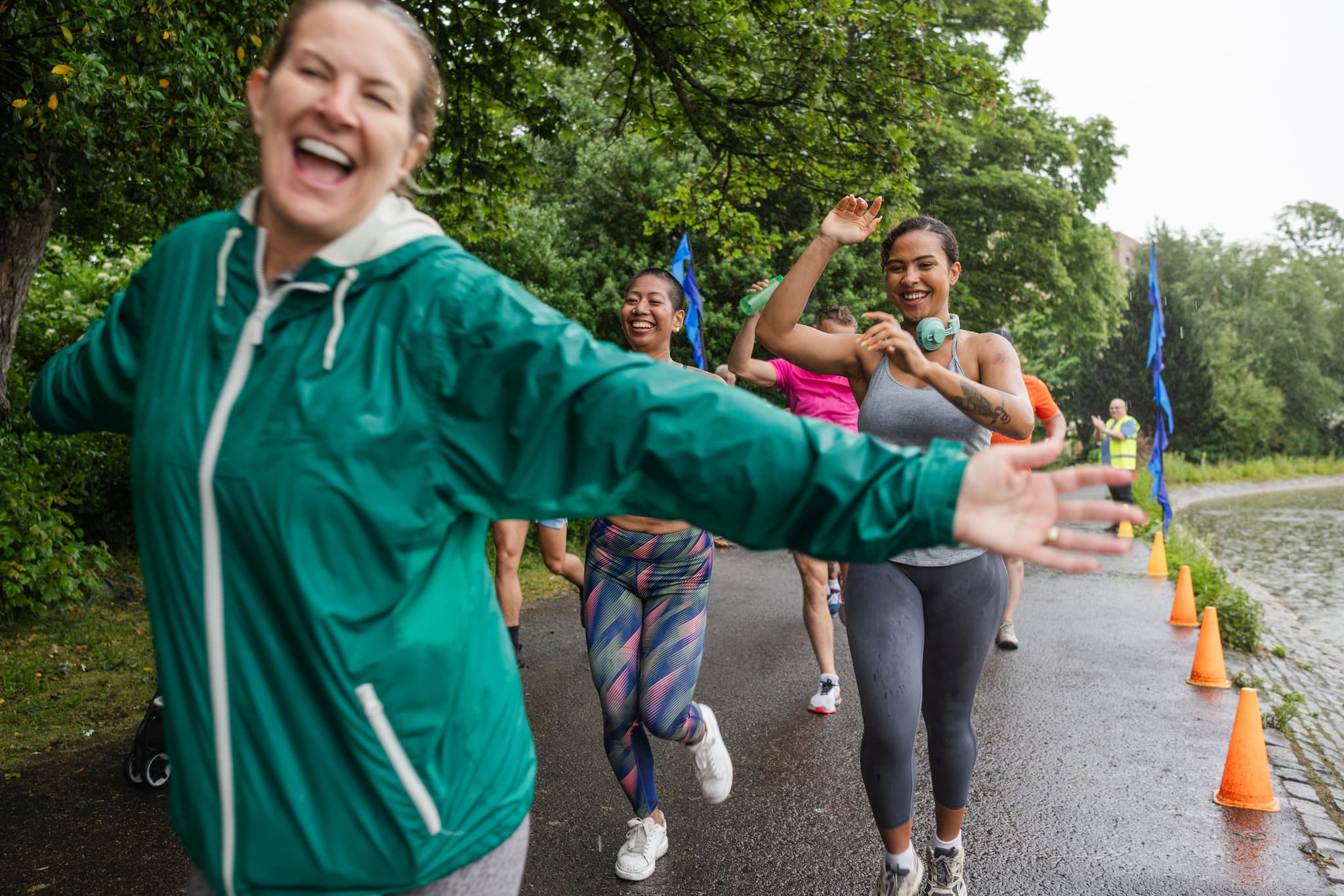 female running group in the rain